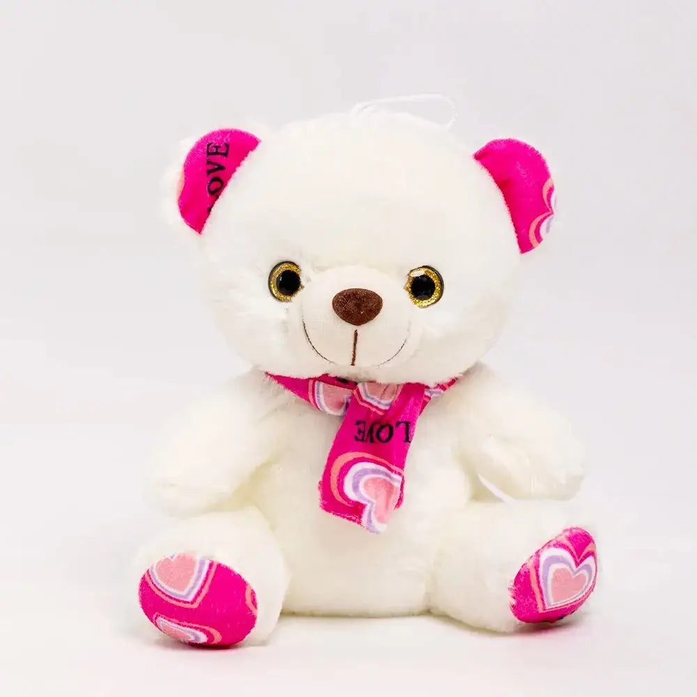 Cute white teddy bear plush toy with a pink heart-patterned scarf, perfect for gifts and hugs.